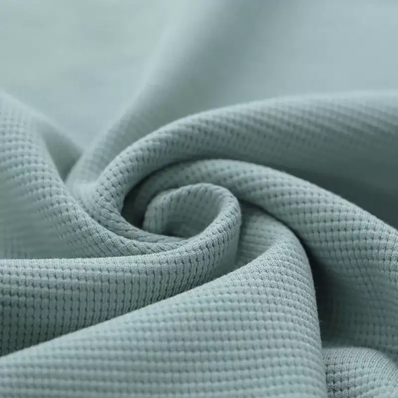 Waffelstrick-Jersey-Stoff Meer Grün ideal zum Nähen für Baby- und Kinderkleidung.